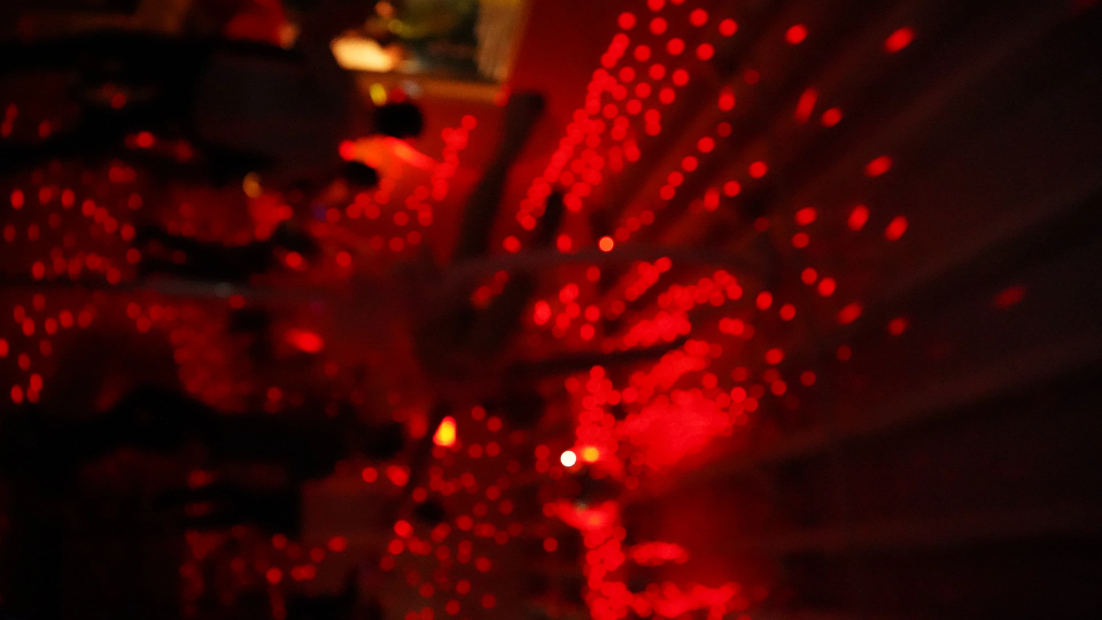 The crowd at a Love Science evening, lit in red